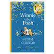 Winnie-the-Pooh 100th anniversary book cover by A.A. Milne and E.H. Shepard with Christopher Robin and Piglet on blue.
