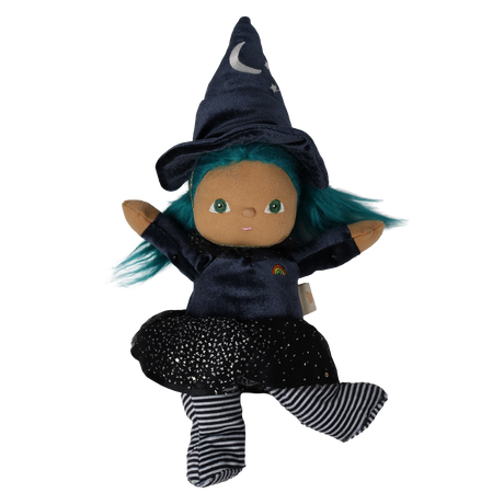 Plush witch doll with teal hair and pointed hat posing playfully with raised arms and a kicked leg.