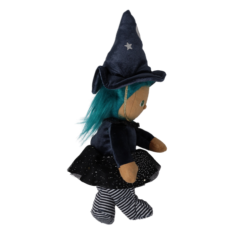 Side profile view of a plush witch doll with teal hair, pointed hat, and striped legs.