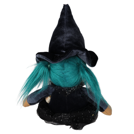 Back view of a seated plush witch doll with teal pigtails and a tall pointed black hat.