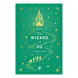 Book cover of The Wizard of Oz by L. Frank Baum featuring a yellow brick road, Emerald City, and character silhouettes.