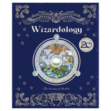Blue book cover titled "Wizardology: The Secrets of Merlin" features an ornate owl, mystical symbols, and a central circle with mythical creatures. Magical tone.