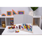 A wooden-framed mirror with four reflective panels arranged to create kaleidoscopic visual effects, ideal for sensory exploration and light play.