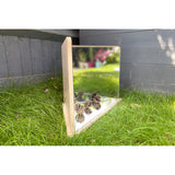 A wooden-framed mirror with four reflective panels arranged to create kaleidoscopic visual effects, ideal for sensory exploration and light play.