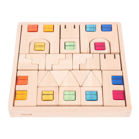 A set of wooden construction blocks with embedded colorful gems, designed to enhance imaginative play, light exploration, and fine motor skills.