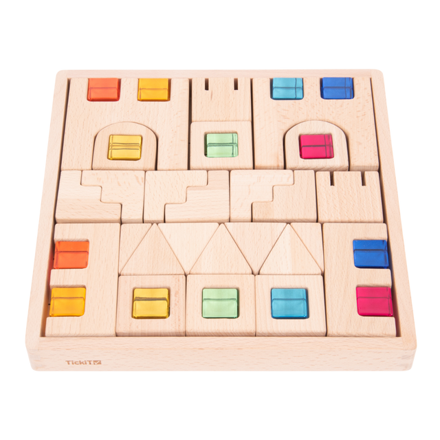 A set of wooden construction blocks with embedded colorful gems, designed to enhance imaginative play, light exploration, and fine motor skills.