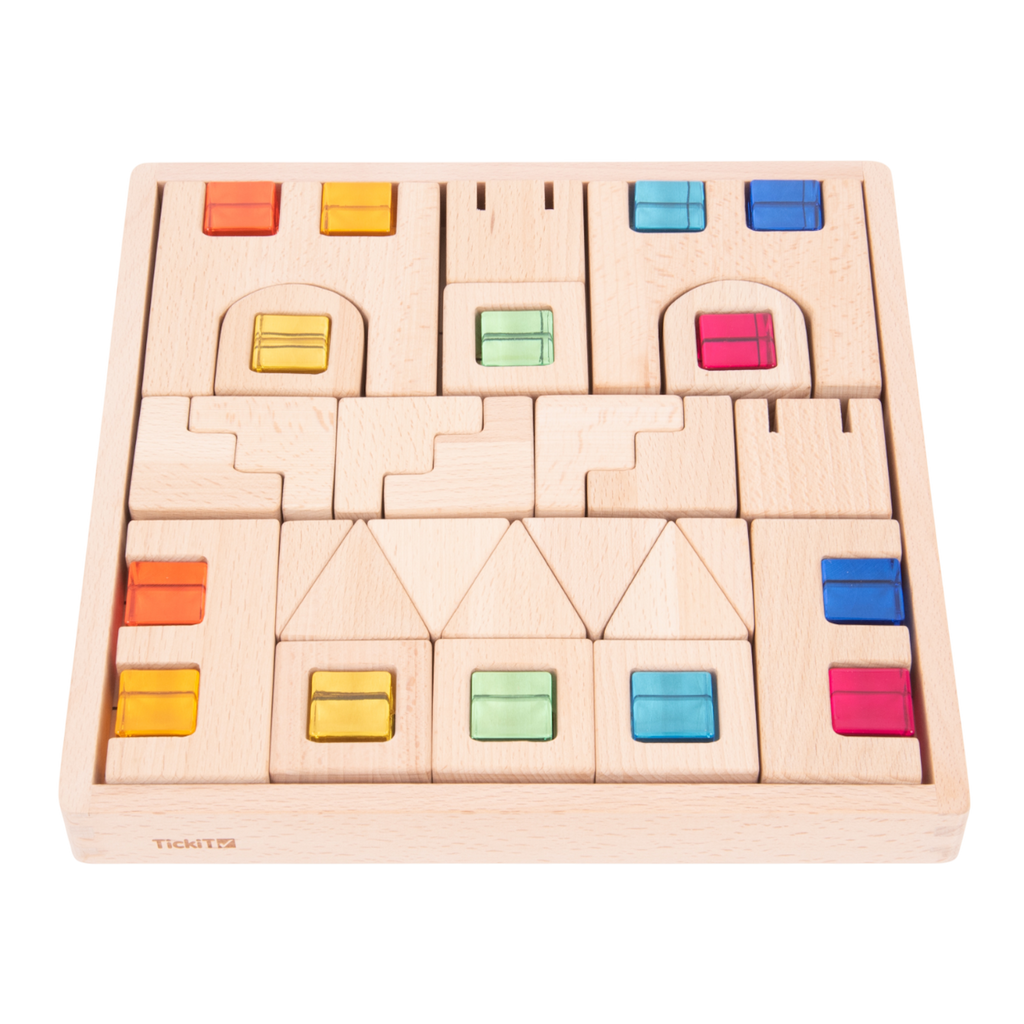A set of wooden construction blocks with embedded colorful gems, designed to enhance imaginative play, light exploration, and fine motor skills.