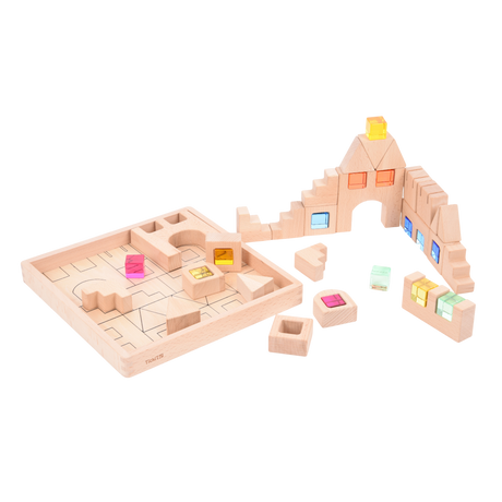A set of wooden construction blocks with embedded colorful gems, designed to enhance imaginative play, light exploration, and fine motor skills.