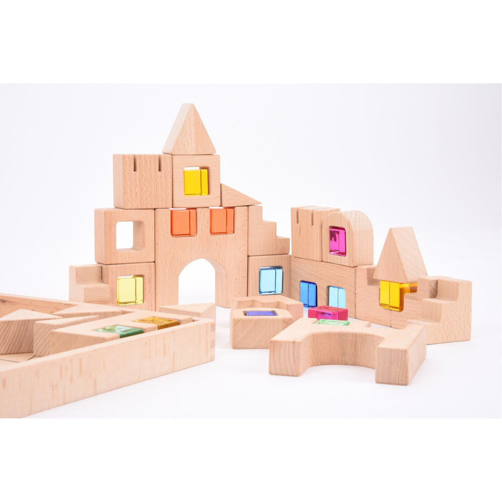 A set of wooden construction blocks with embedded colorful gems, designed to enhance imaginative play, light exploration, and fine motor skills.