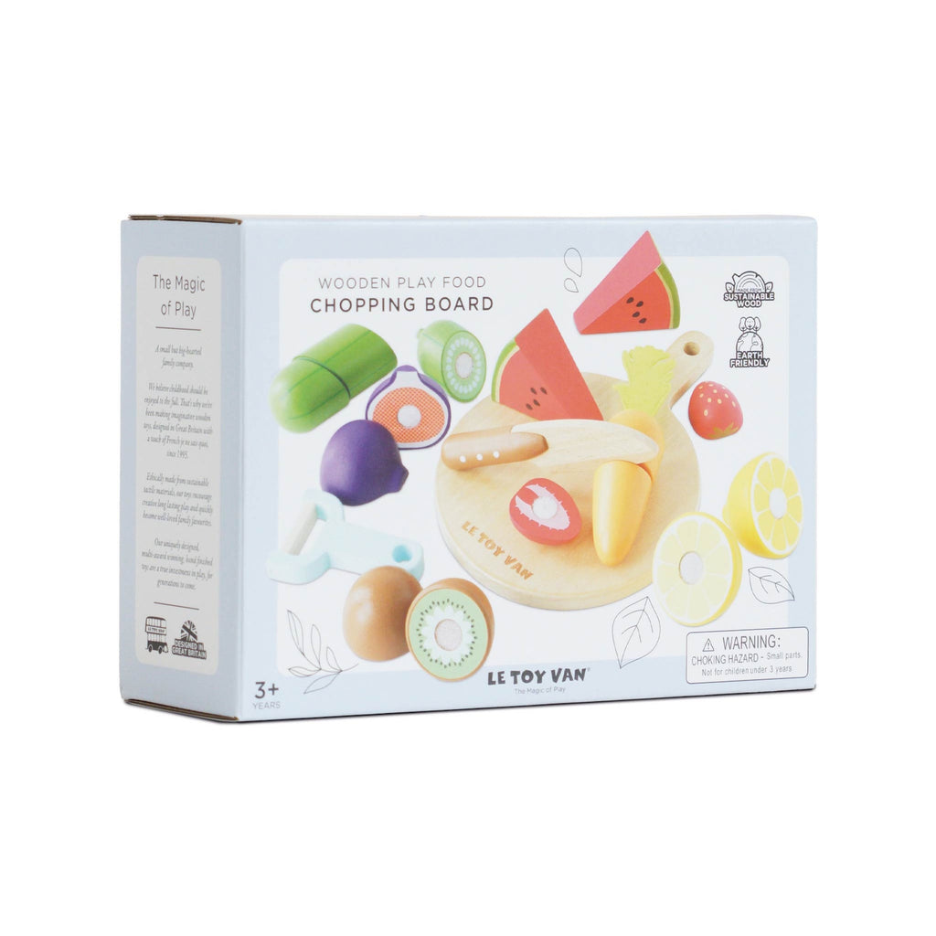 Box for "Le Toy Van" wooden play food set featuring colorful fruits and vegetables, chopping board, and knife. Eco-friendly, for ages 3+, cheerful tone.