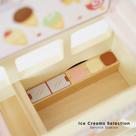 Inside view of wooden toy ice cream van showing service station selection.