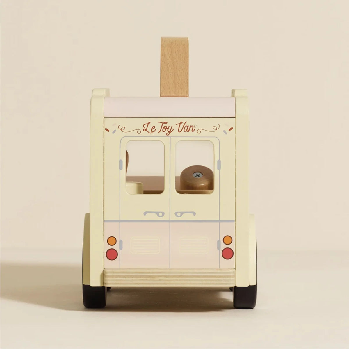 Rear view of Le Toy Van wooden ice cream toy showing back doors, taillights, and brand logo.