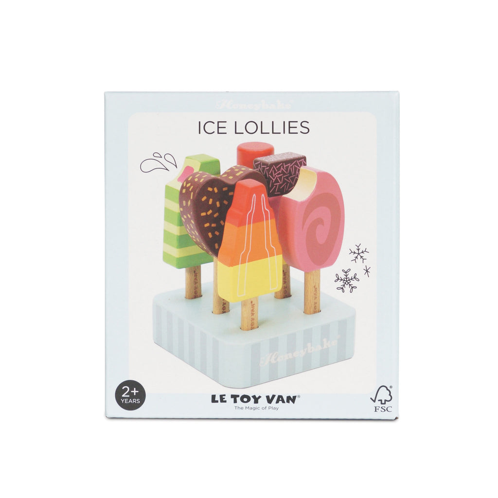 Box of Le Toy Van ice lollies with colorful wooden popsicles on a striped stand. Packaging conveys playful and imaginative vibes for ages 2+.