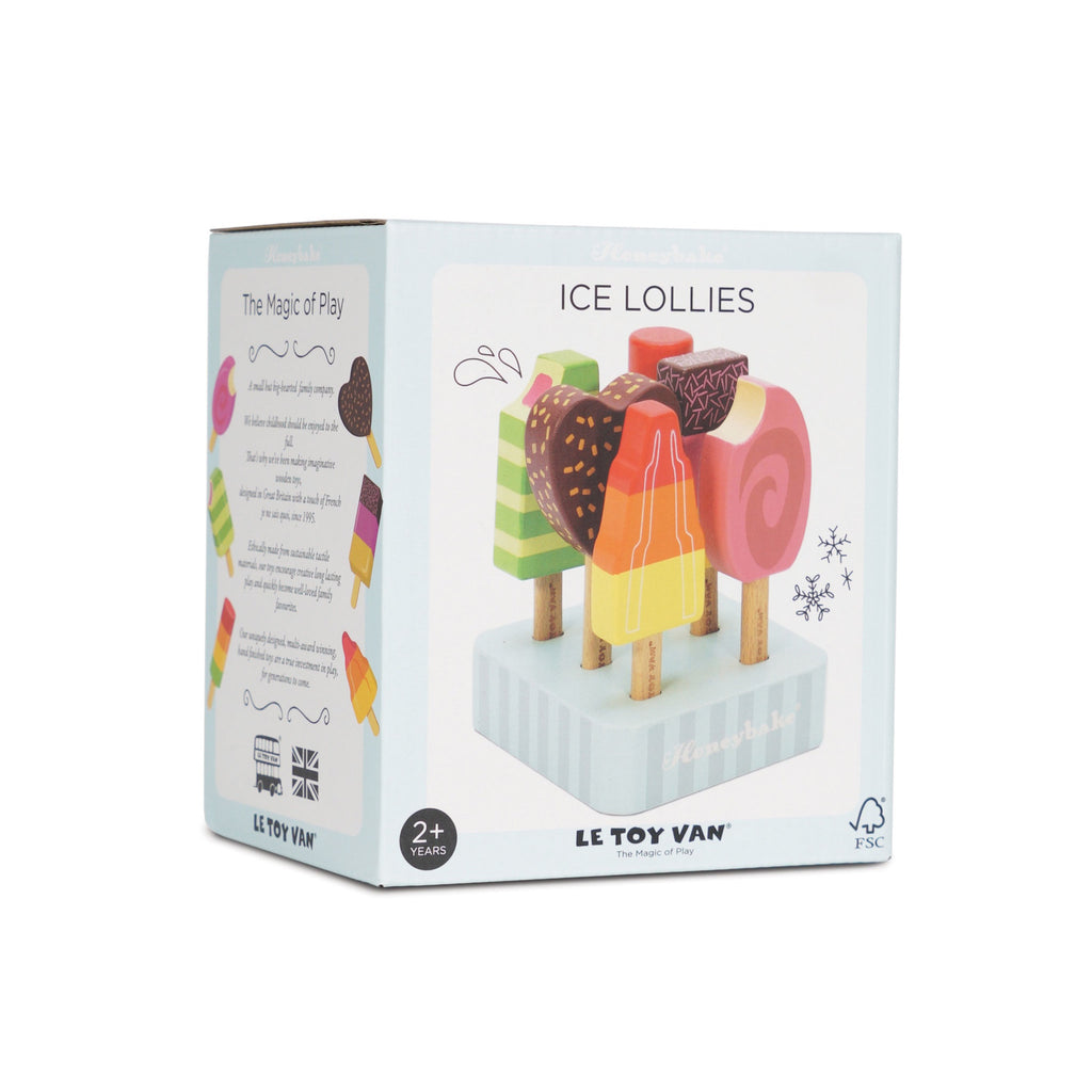 Box of Le Toy Van ice lollies with colorful wooden popsicles on a striped stand. Packaging conveys playful and imaginative vibes for ages 2+.