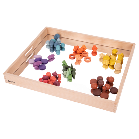 A sturdy wooden tray with a mirrored base, designed to enhance sensory exploration, loose parts play, and visual perception activities.