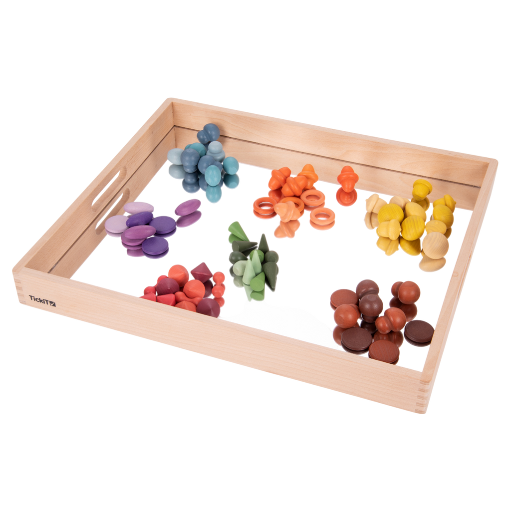 A sturdy wooden tray with a mirrored base, designed to enhance sensory exploration, loose parts play, and visual perception activities.