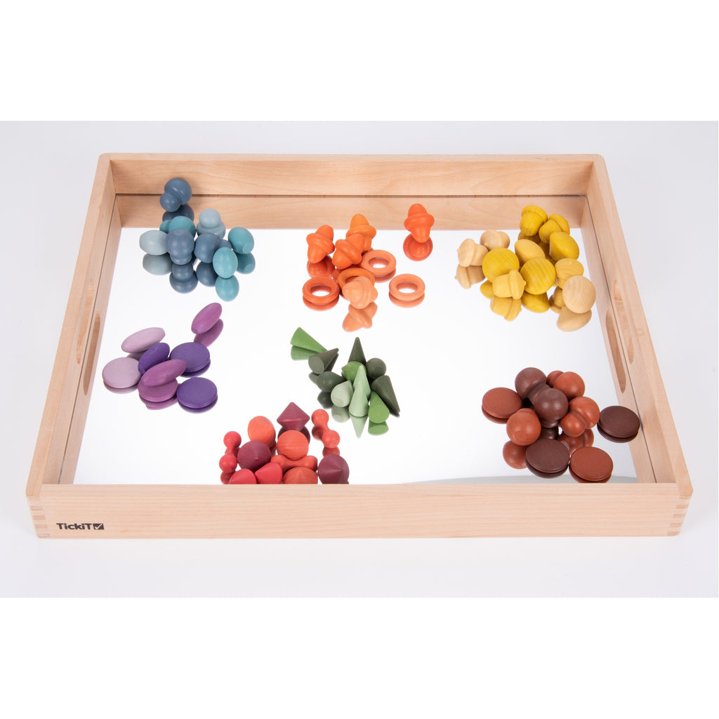 A sturdy wooden tray with a mirrored base, designed to enhance sensory exploration, loose parts play, and visual perception activities.
