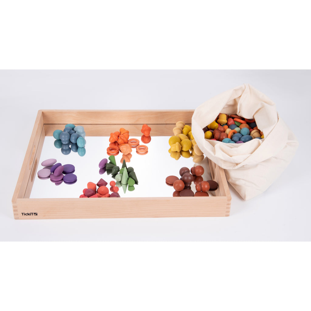 A sturdy wooden tray with a mirrored base, designed to enhance sensory exploration, loose parts play, and visual perception activities.