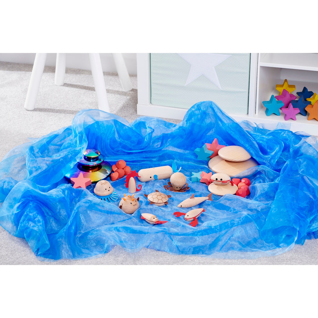 A set of brightly painted wooden marine animals, perfect for imaginative play, storytelling, and early learning activities.