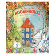 Cover of "A Year in the Moominhouse" book, featuring colorful seasonal scenes with Moomin characters around a tall blue house and lush flora.