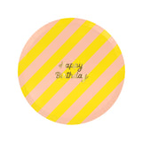 Round paper plate with yellow and pink diagonal stripes and gold text reading "Happy Birthday".