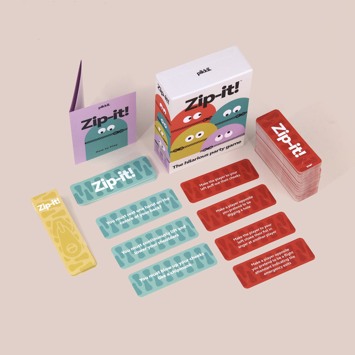 Zip-it! party game box, rules booklet, and colorful action cards spread on a plain background.
