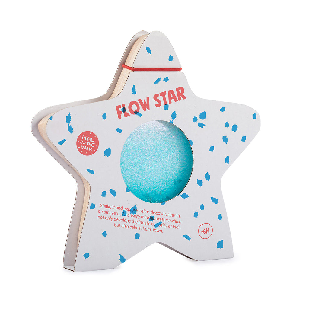 A star-shaped wooden sensory toy by Petit Boum, featuring blue glittery liquid inside, with packaging labeled "Flow Star" and "Glow in the Dark."