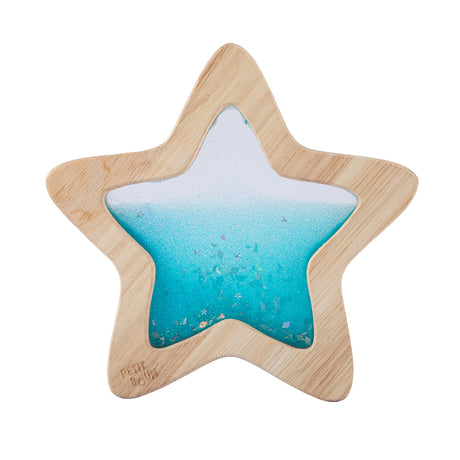 A wooden star-shaped sensory toy filled with vibrant blue glittery liquid, designed for visual stimulation.